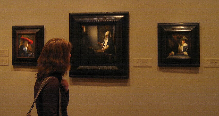Photo of Woman Holding a Balance by Johannes Vermeer