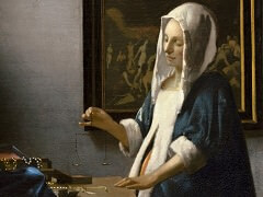 Woman Holding a Balance by Johannes Vermeer